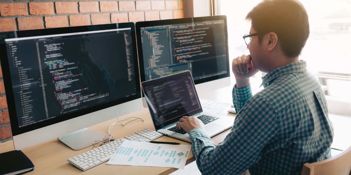 Man on his computer using wordpress.