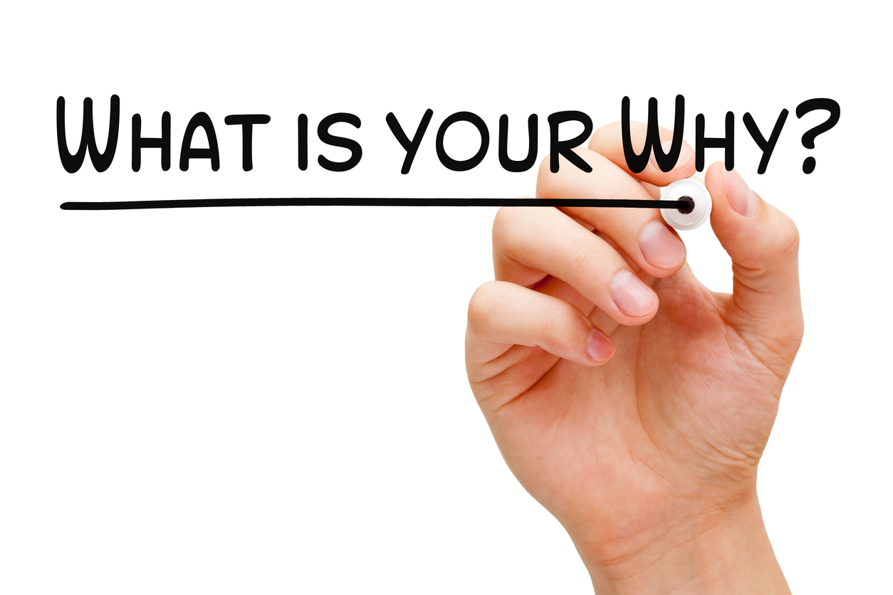 A dry-erase board that says 'what is your why?'