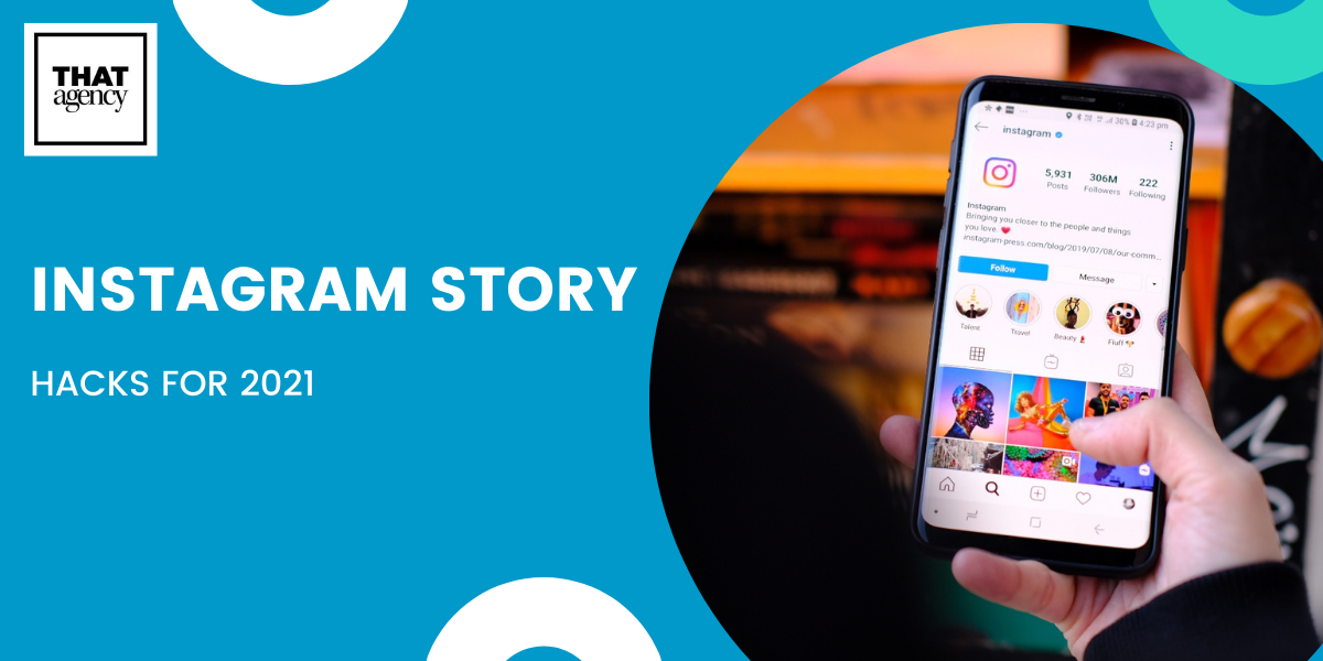 A hand holding a mobile phone with a collection of Instagram stories on the screen