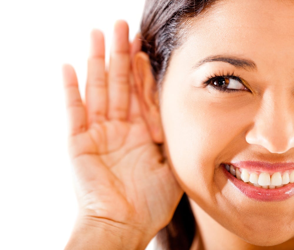 Woman listening - isolated over a white background.jpeg