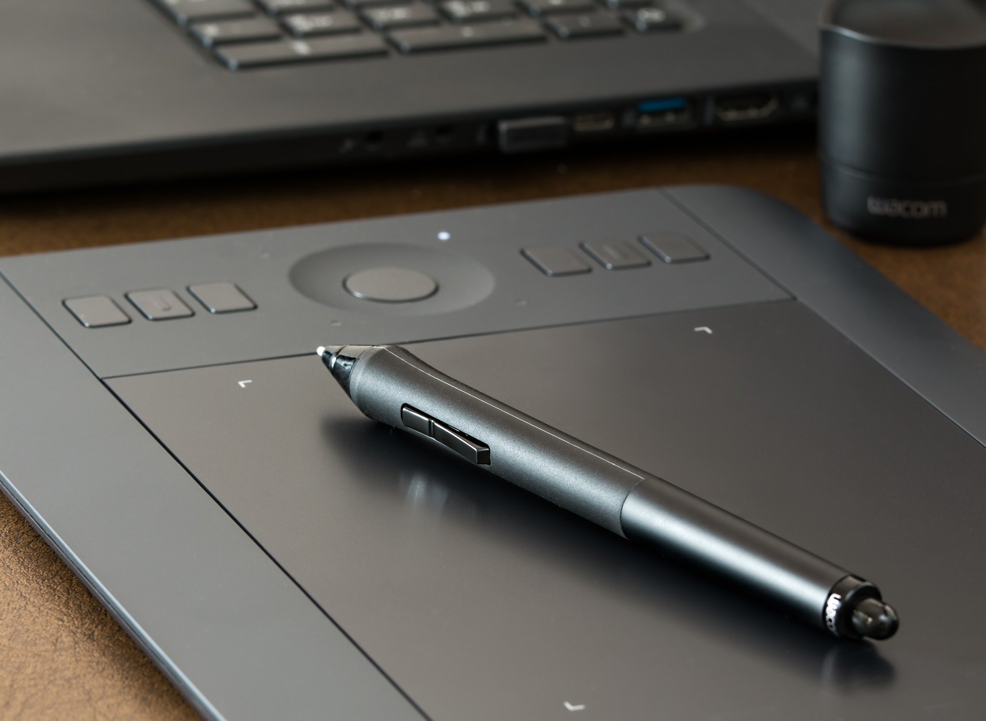 A graphic designer's drawing pad and pen.